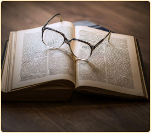 Book glasses on table.